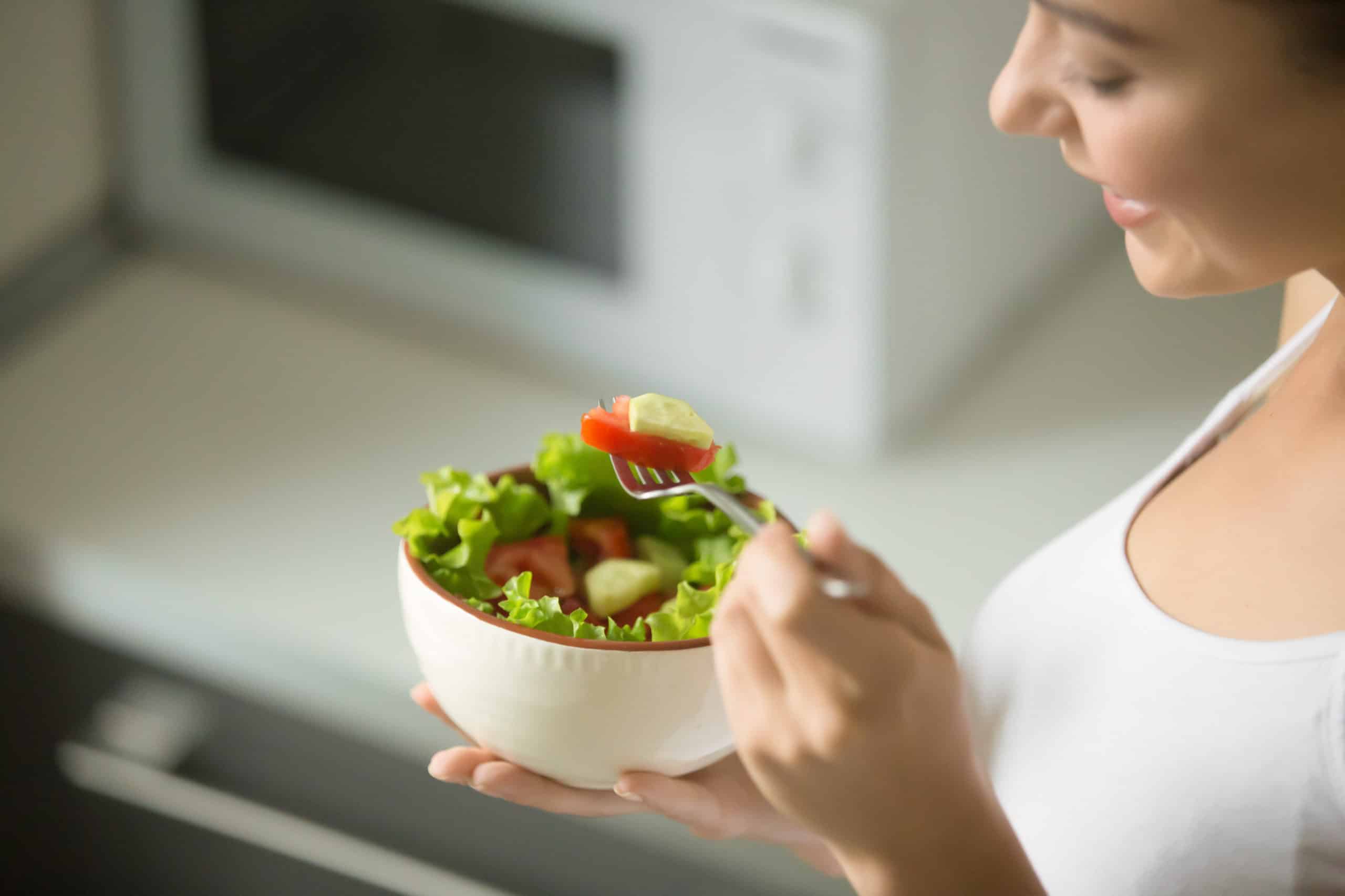 bowl-fresh-green-salad-hold-female-hands-scaled
