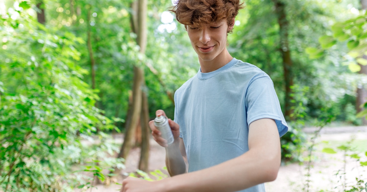 man-applying-insect-repellent-against-mosquito-tick-his-arms-during-hike-nature-skin-protection-against-insect-bite
