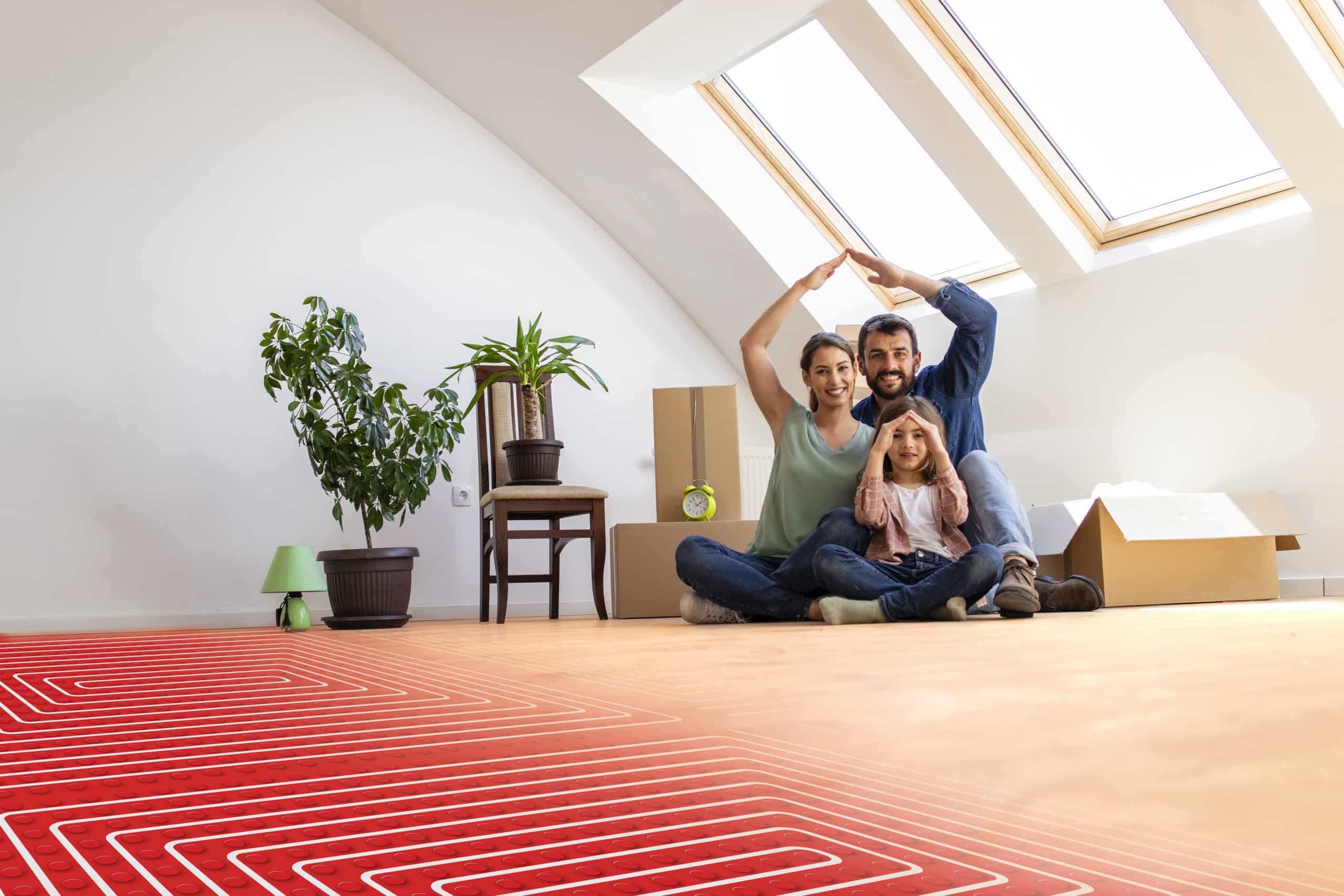 portrait-happy-family-sitting-warm-parquet-with-floor-heating-pipes-scaled