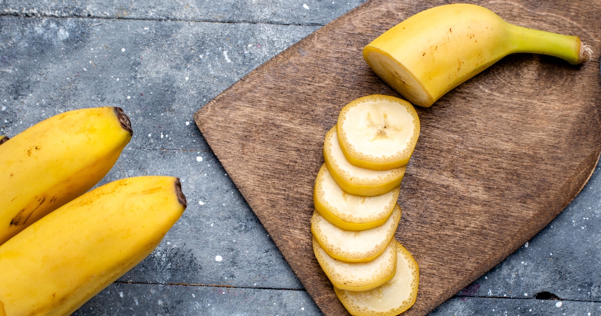 top-closer-view-fresh-yellow-bananas-sliced-whole-grey